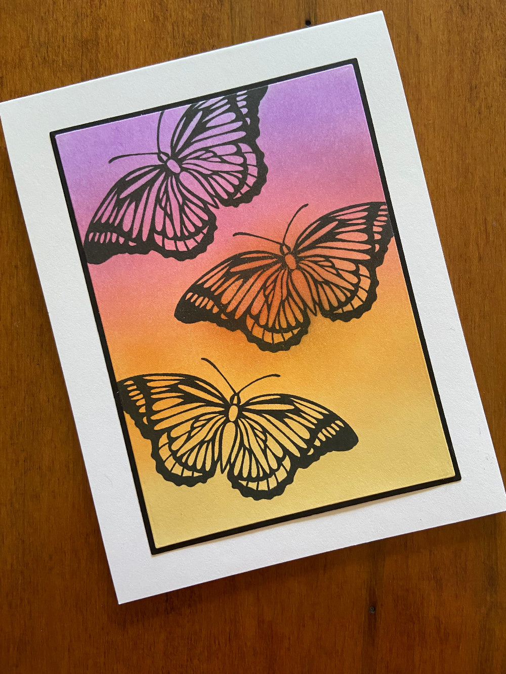 Handmade any occasion card with butterfly silhouettes on sunset ink-blended background