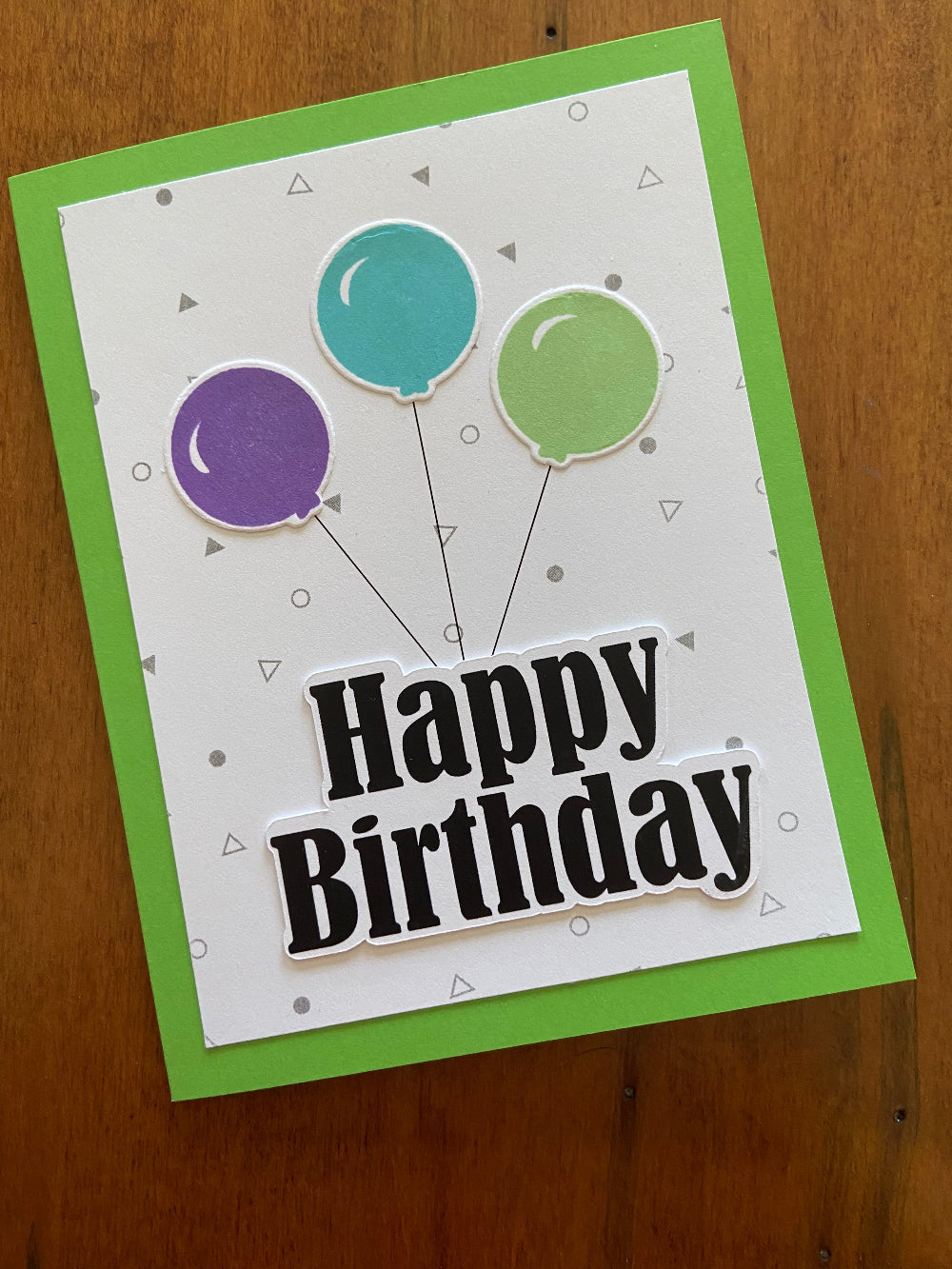 Balloon Birthday Card, handmade card, 3 balloons in purple, turquoise and green with a bold happy birthday die cut sentiment.