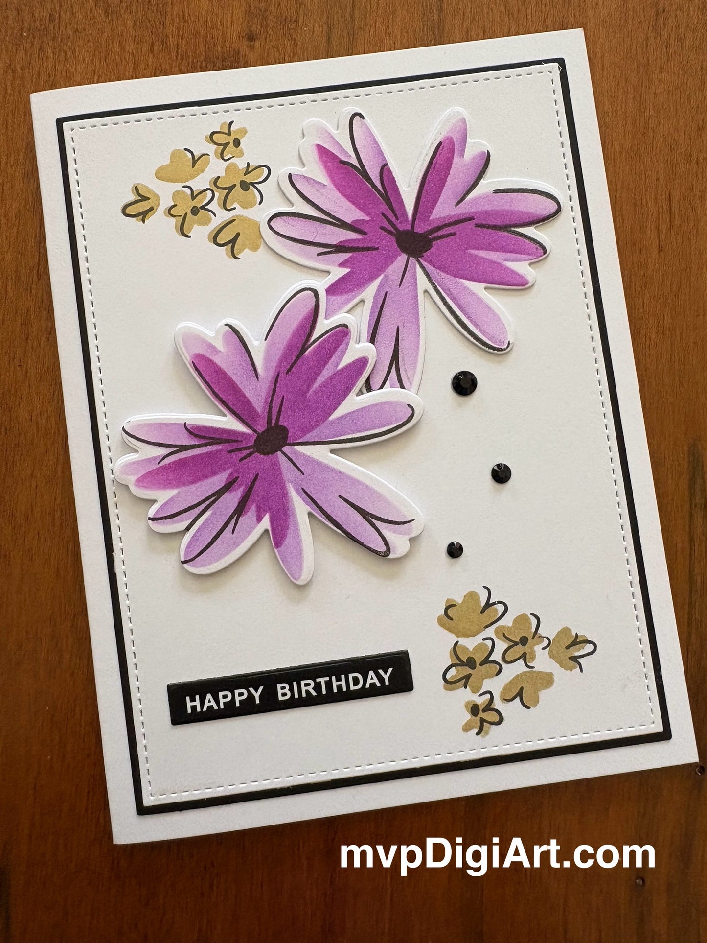 Handmade birthday card with modern purple and gold floral design and black gem accents and 'Happy Birthday' text.