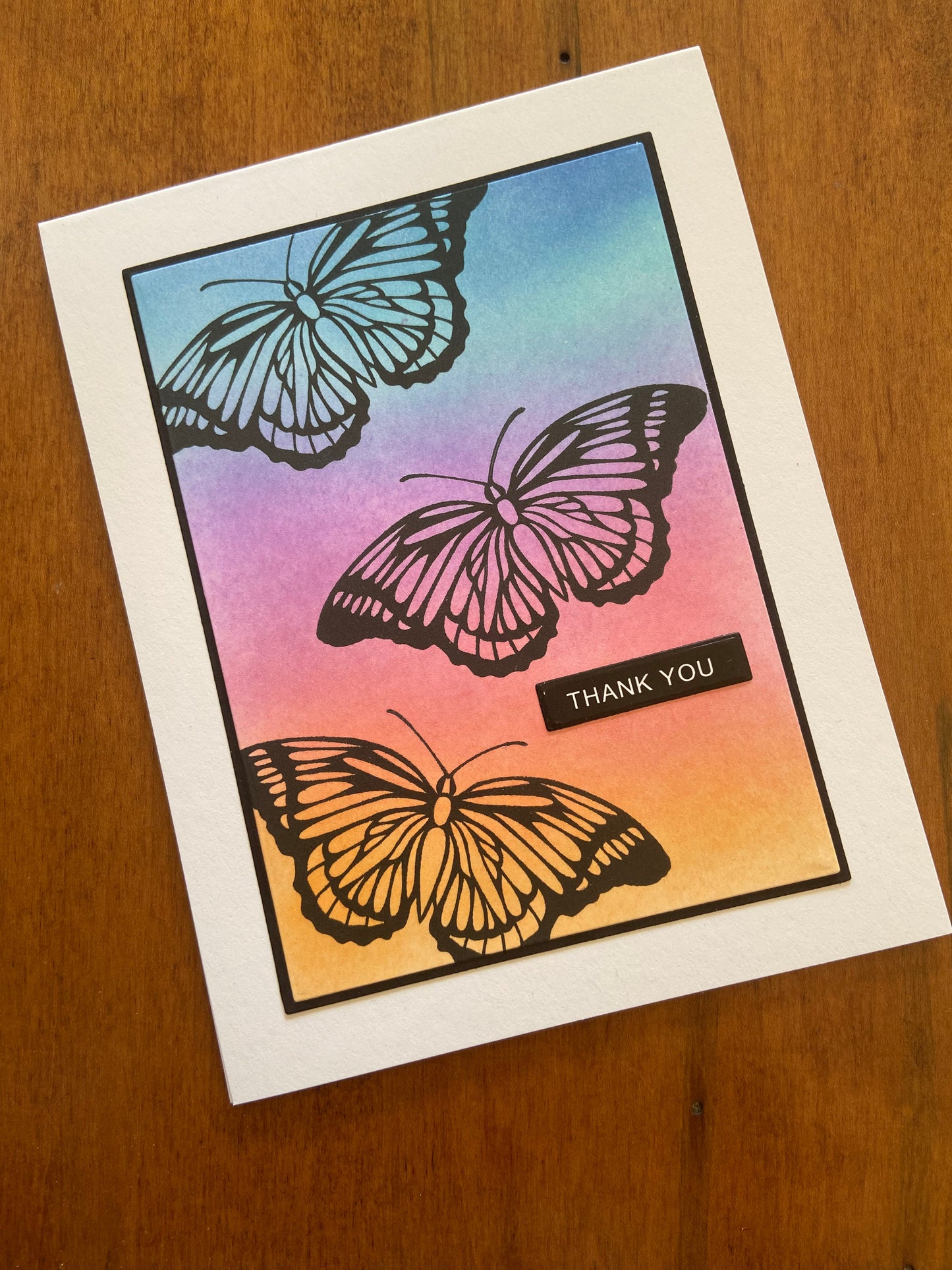 Card with three butterfly illustrations on an ink blended background, featuring 'thank you' text, part of the 4 pack set