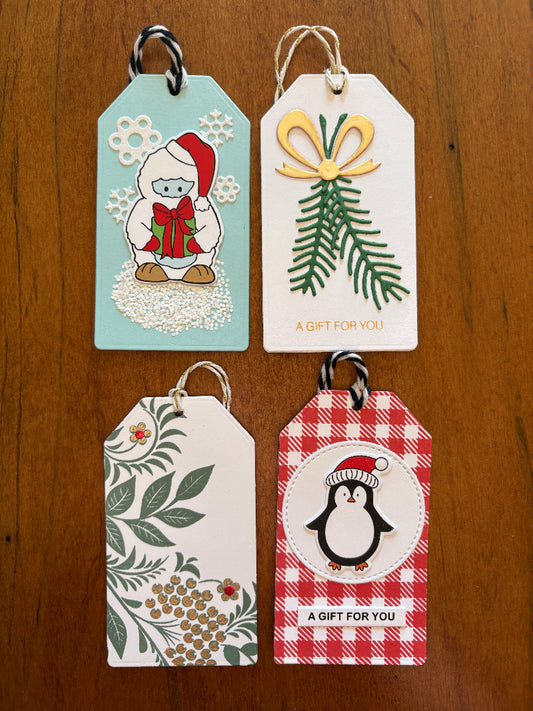 Christmas gift tags featuring yeti, vines, pine, and penguin designs - front view