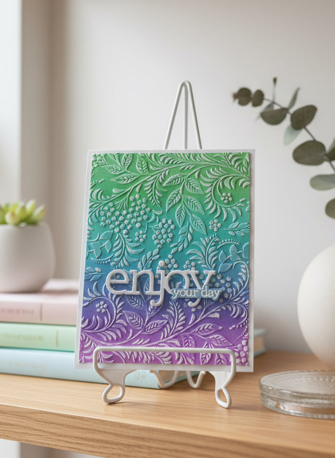 Decorative card with floral pattern on a shelf with decorative books