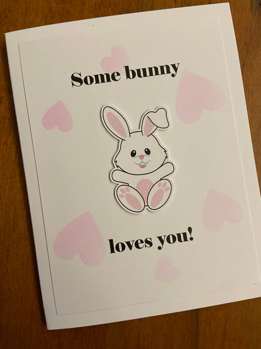 Some Bunny Loves You handmade love or Valentines Day card. Cute die cut bunny focal image; pink stamped hearts in the white background.
