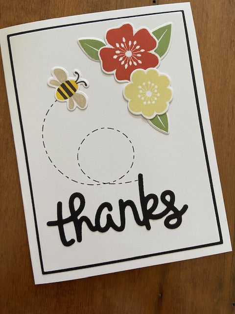 Handmade thank you card featuring flowers and a bee and text ‘thanks’