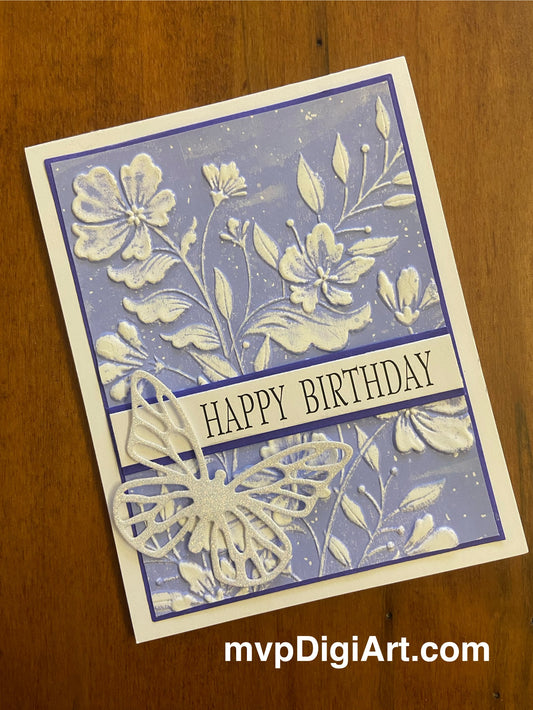 Handmade Happy Birthday card with periwinkle blue and white floral pattern and a butterfly, including the text 'HAPPY BIRTHDAY'.