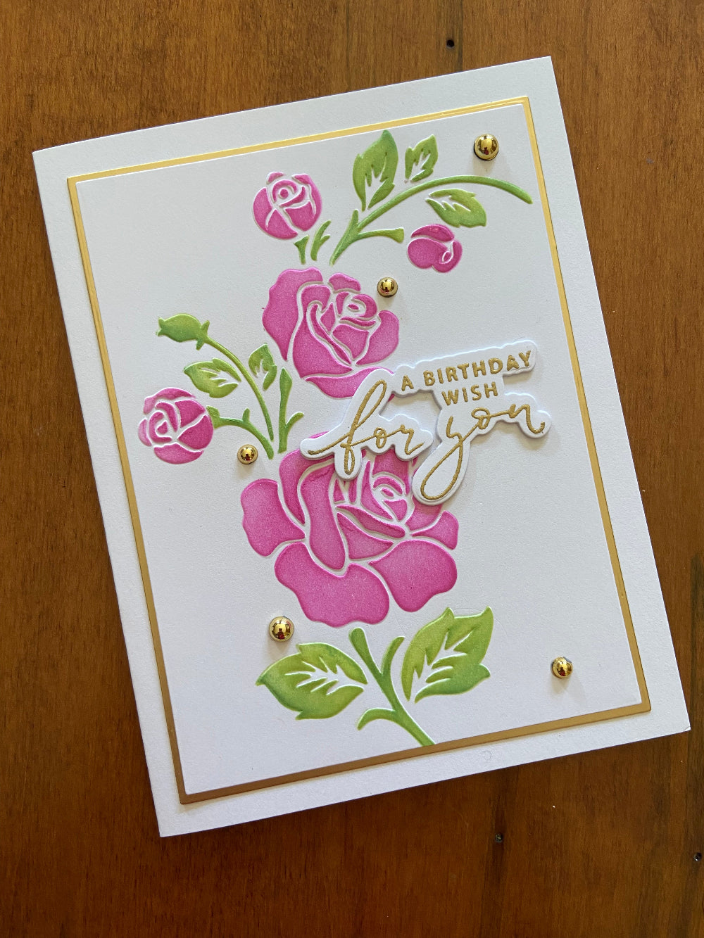 Handmade birthday card with a floral design in pink and green, gold accents, and the text 'A Birthday Wish For You' on the front.