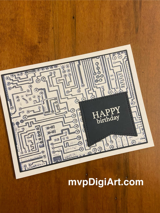 A handmade birthday card with a dark blue circuit board design pressed into white cardstock and 'happy birthday' in message in white is centred in a dark blue die-cut flag.