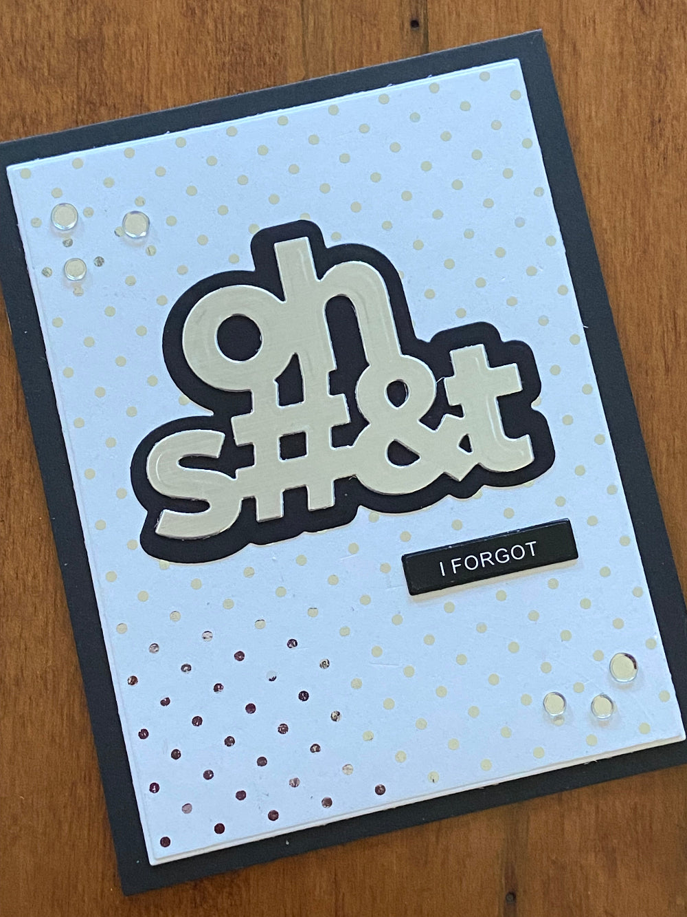 Funny belated birthday card featuring silver metallic 'Oh Shit I Forgot' die-cut text with confetti embellishments on black cardstock with gold foiled Swiss dot pattern handmade greeting card
