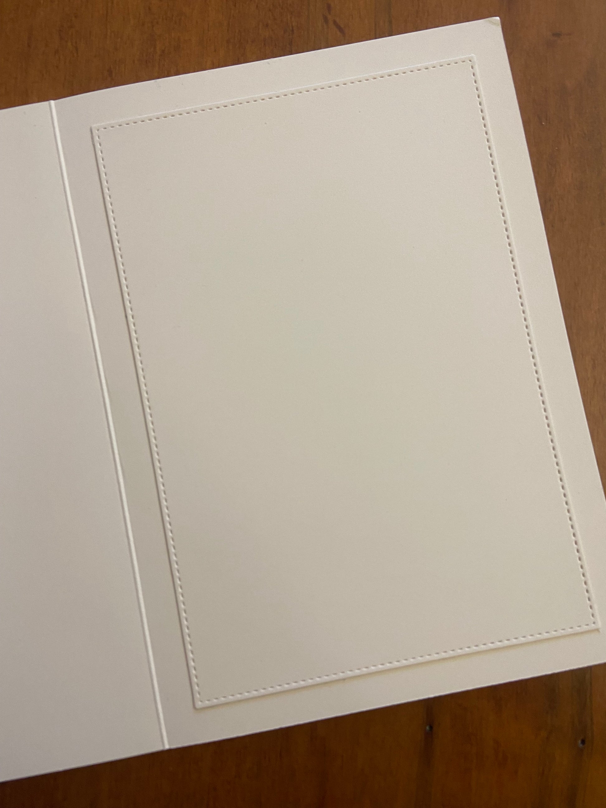 Inside of handmade birthday card showing stitched die-cut panel for personal messages