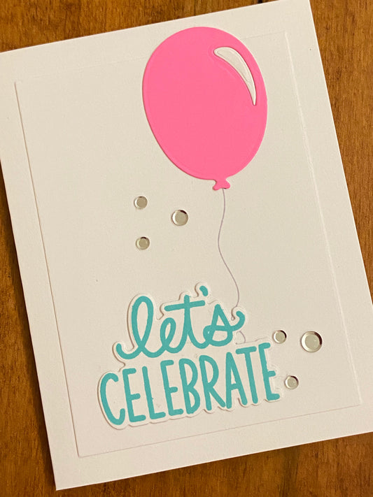 Celebration card with large pink balloon and 'Let's Celebrate' text turquoiseo stamped die cut. Silver confetti for sparkle