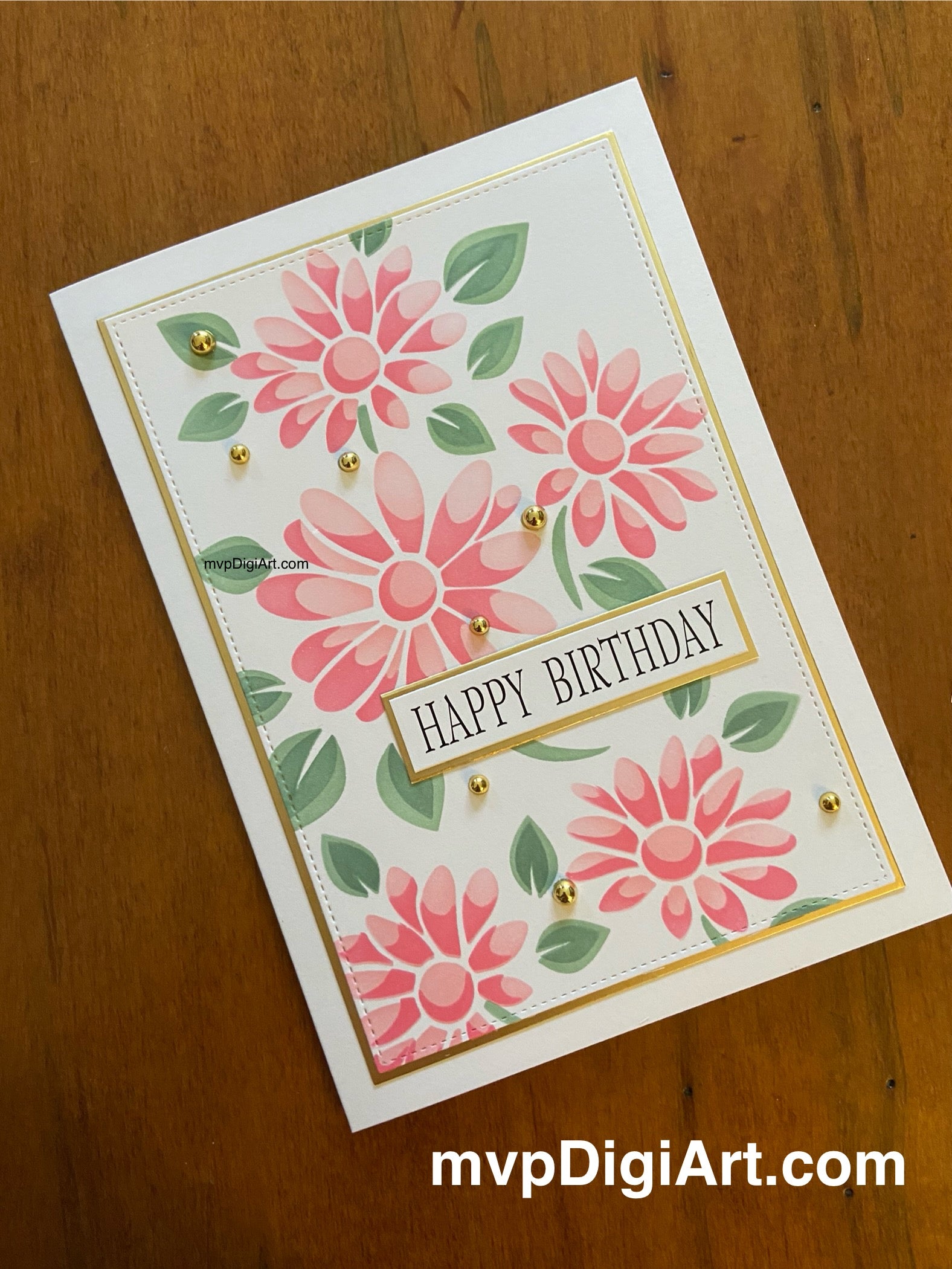 Handmade birthday card with pink ink-blended daisies, green leaves, gold matting and pearl accents