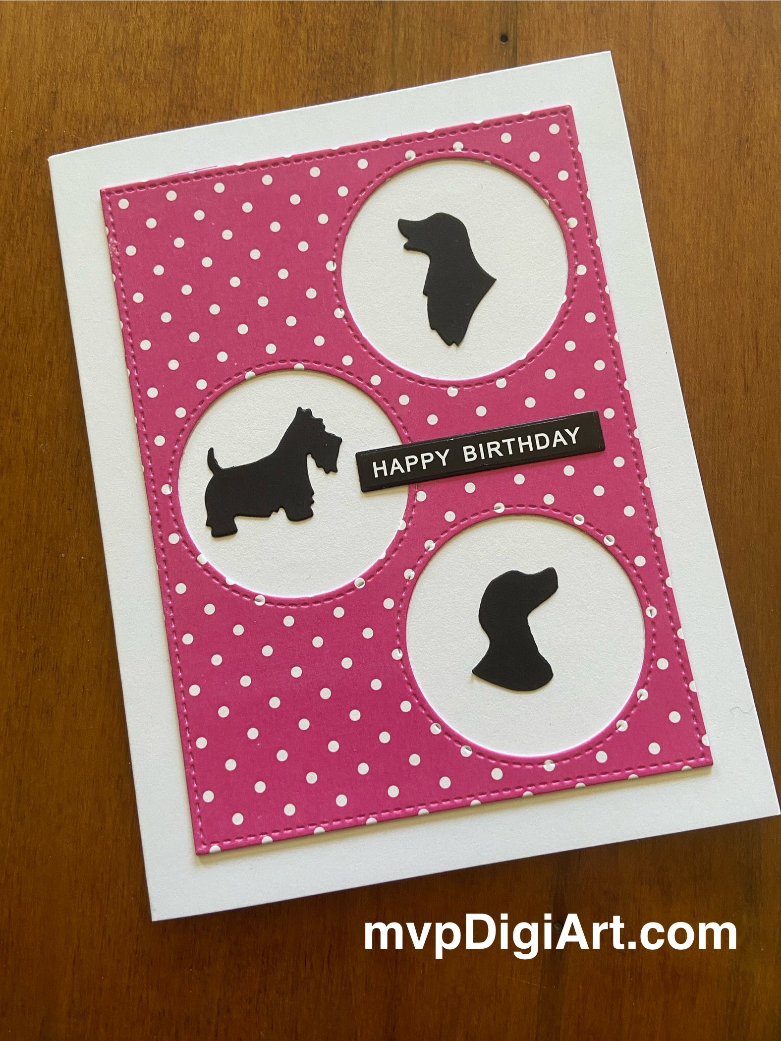 Handmade birthday card with hot pink and white Swiss dot background, black dog silhouettes, on a white notecard. 