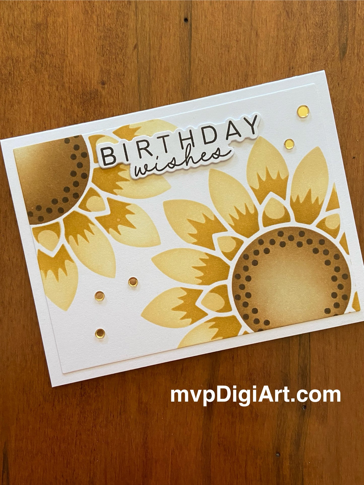 Handmade birthday card with two vibrant sunflowers in yellow and orange with gold confetti embellishments on white background