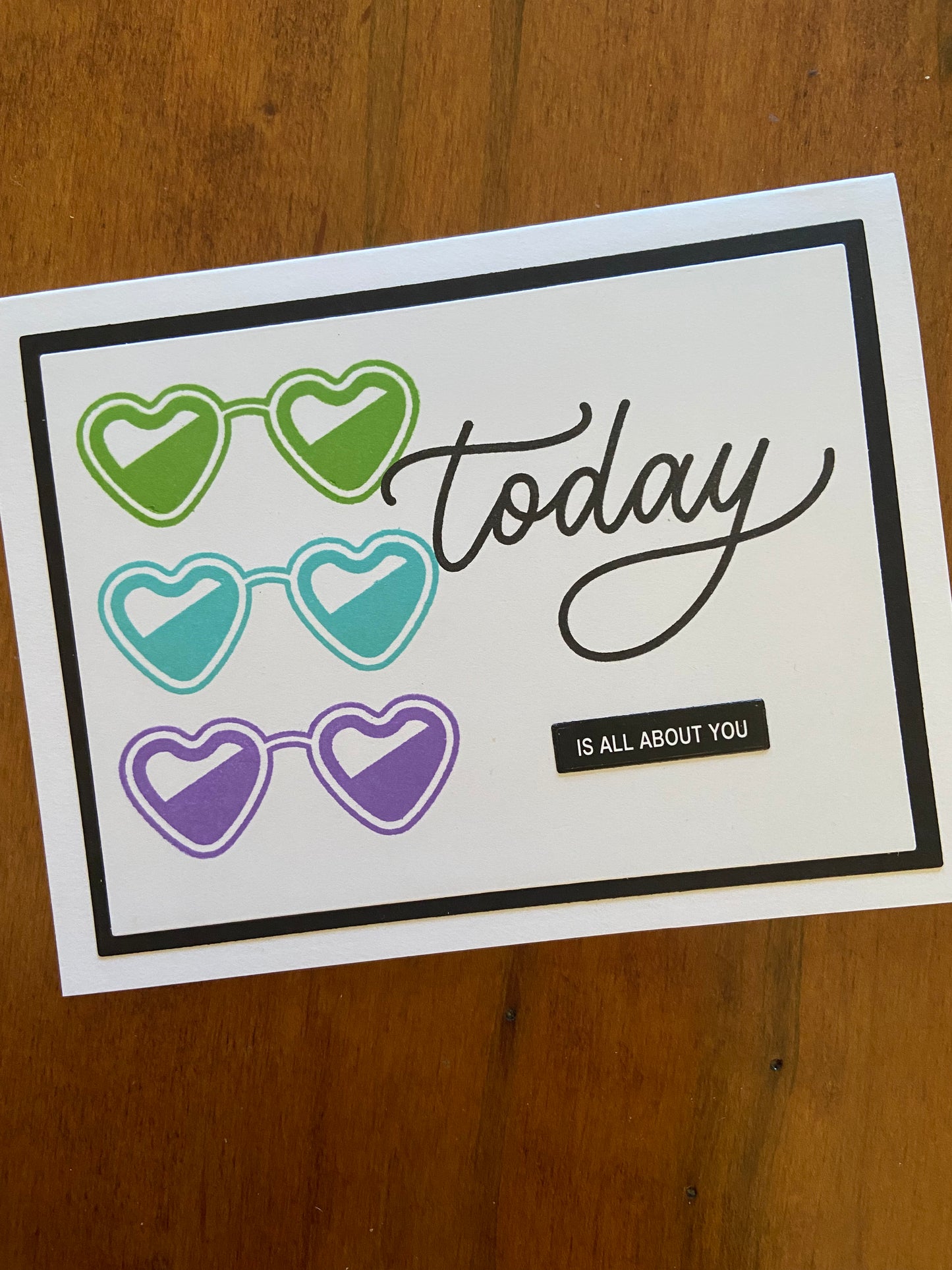 Handmade birthday celebration card with Today Is All About You sentiment and three heart-shaped sunglasses in purple, turquoise and green