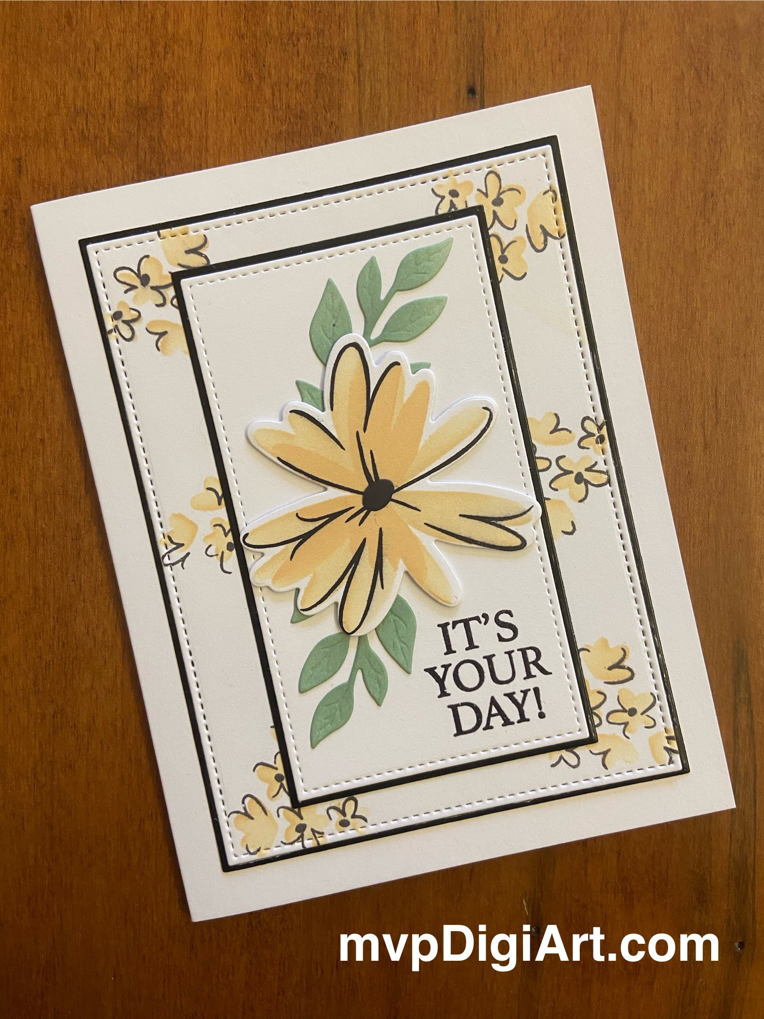 A handmade yellow and black sketched floral greeting card with the text 'It's Your Day' stamped on it.