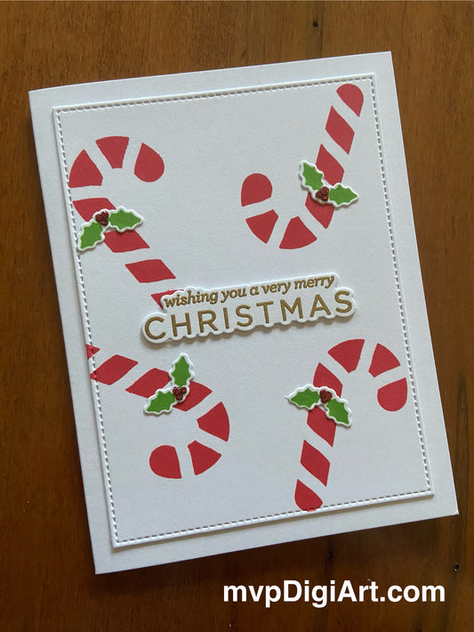 A handmade Christmas card with candy canes and holly decorations, featuring a gold heat embossed sentiment.