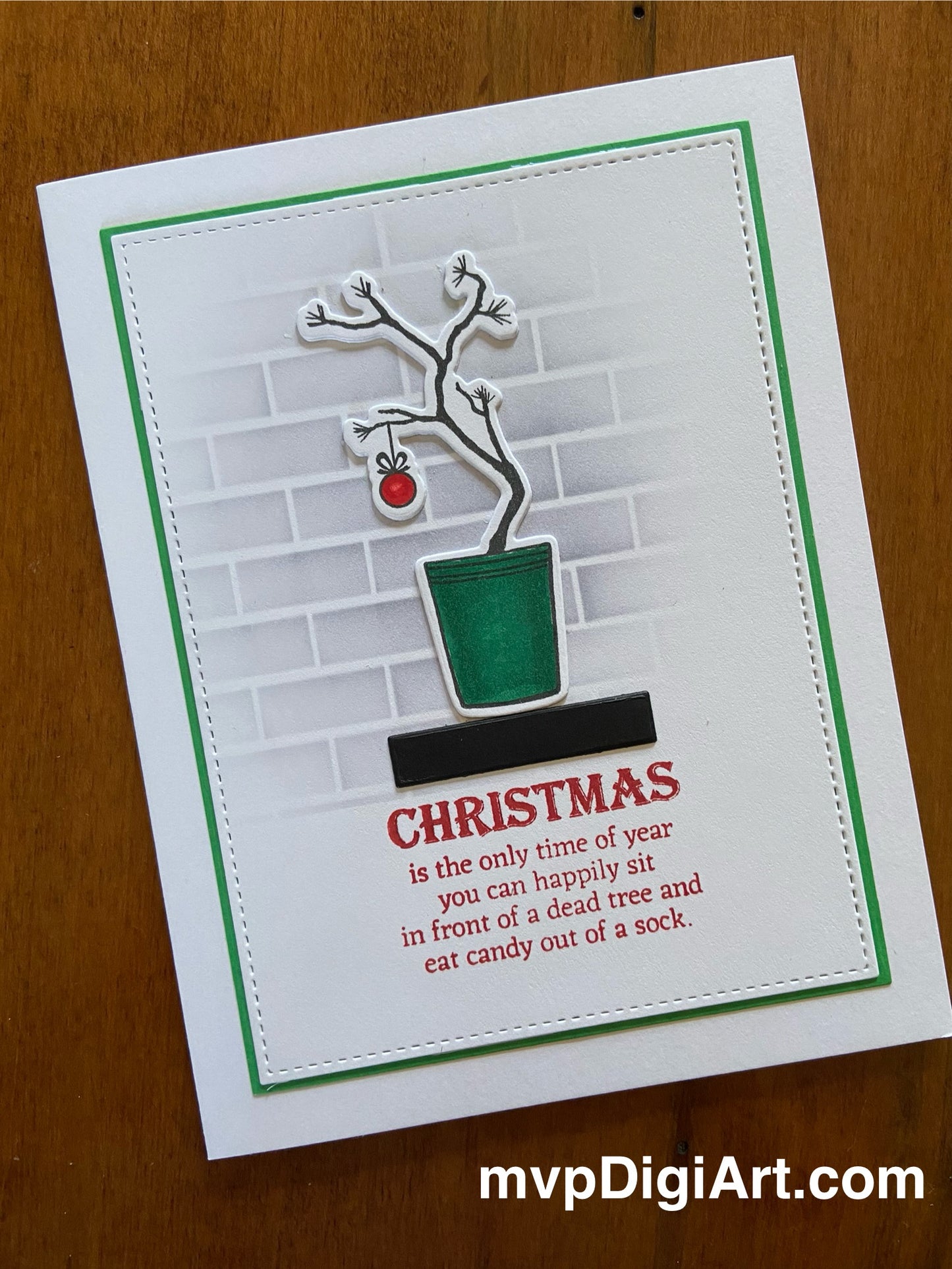 Handmade Christmas card with Charlie Brown Christmas tree on shelf on a white notecard