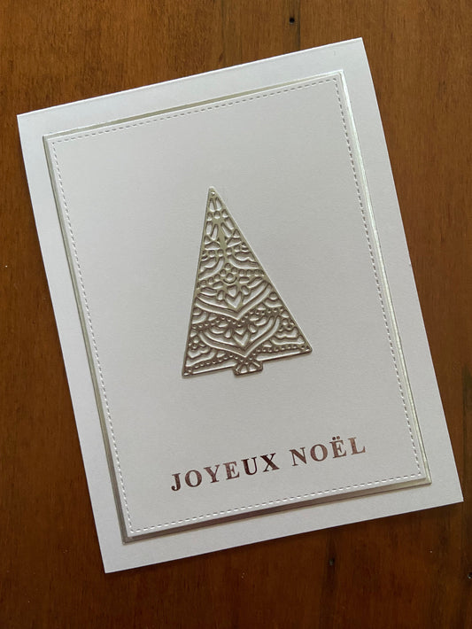 Handmade French Christmas card with silver foil die-cut tree and Joyeux Noël on white