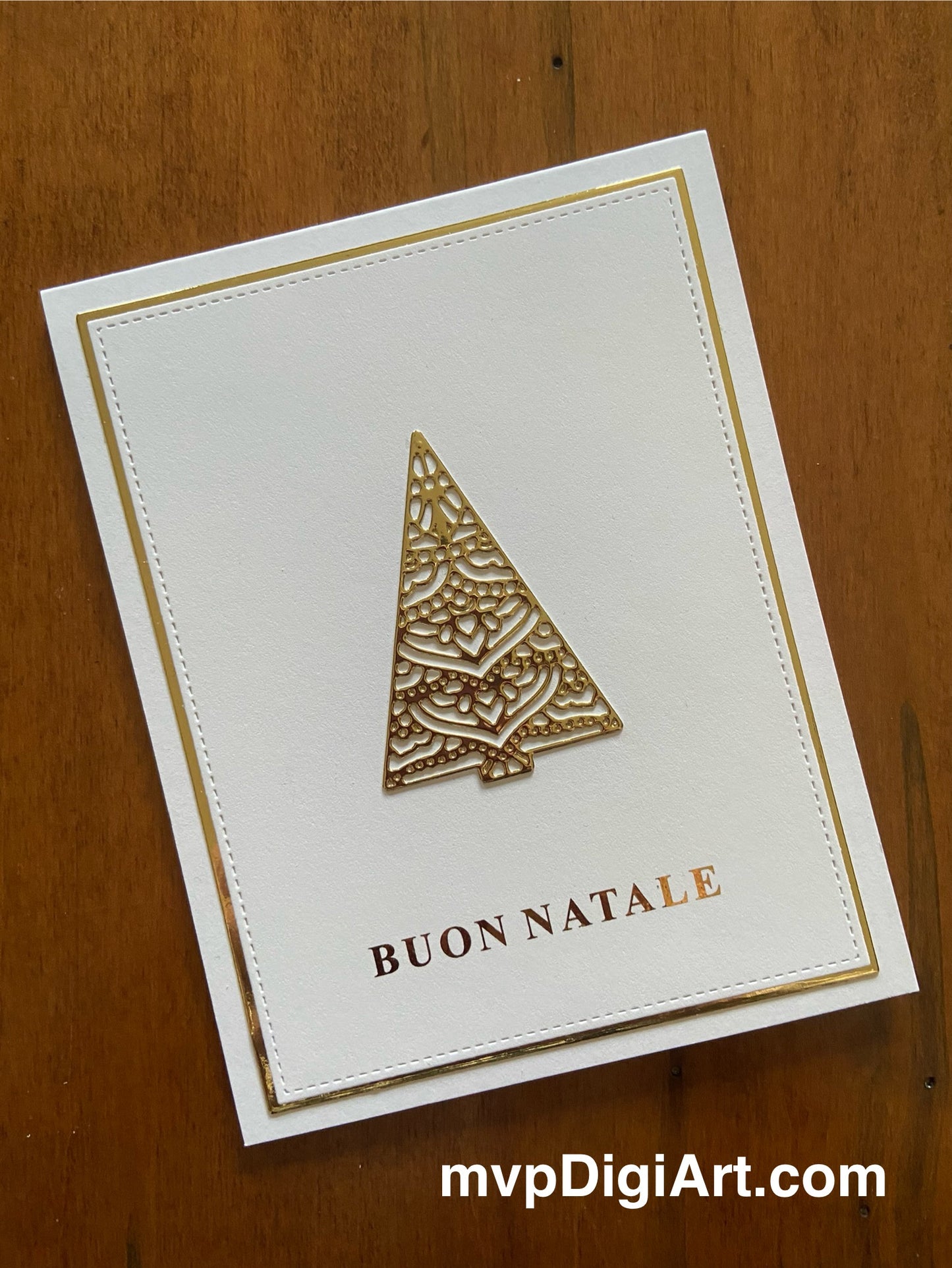 Handmade Italian Christmas card with ornate gold embossed tree design and 'Buon Natale' greeting on white background