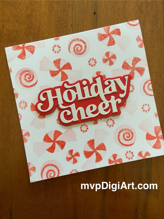 A square handmade Christmas card with a peppermint candy pattern and the text 'Holiday Cheer' boldy displayed in a die cut font on a red shadow background.