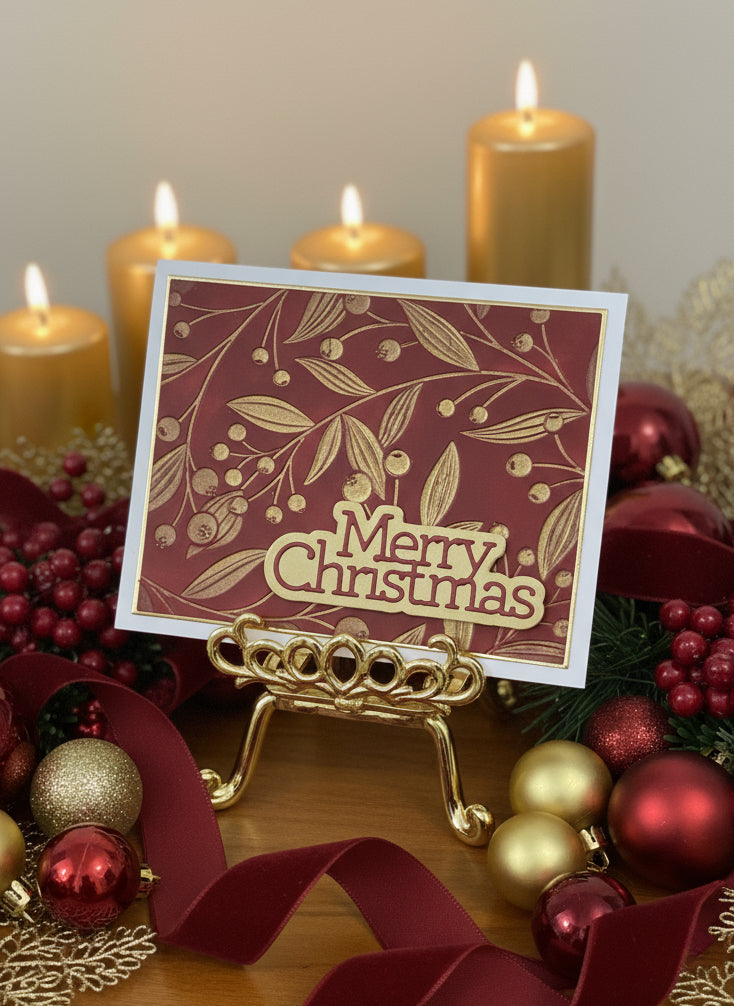 Christmas card with red panel featuring gold berries and vine design with 'Merry Christmas' text displayed with festive holiday decorations