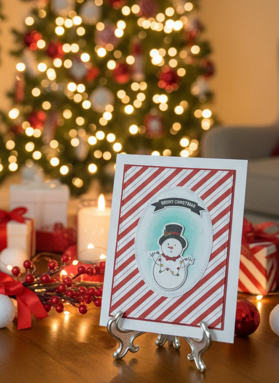 Christmas card with a snowman design on decorated shelf.