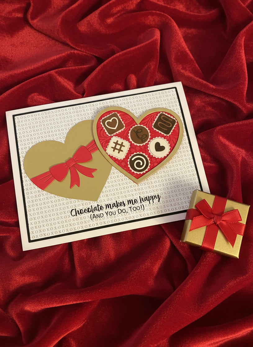 Card for love or Valentine's Day with a a heart-shaped box of chocolates and an XOXOX background laid on red velvet.