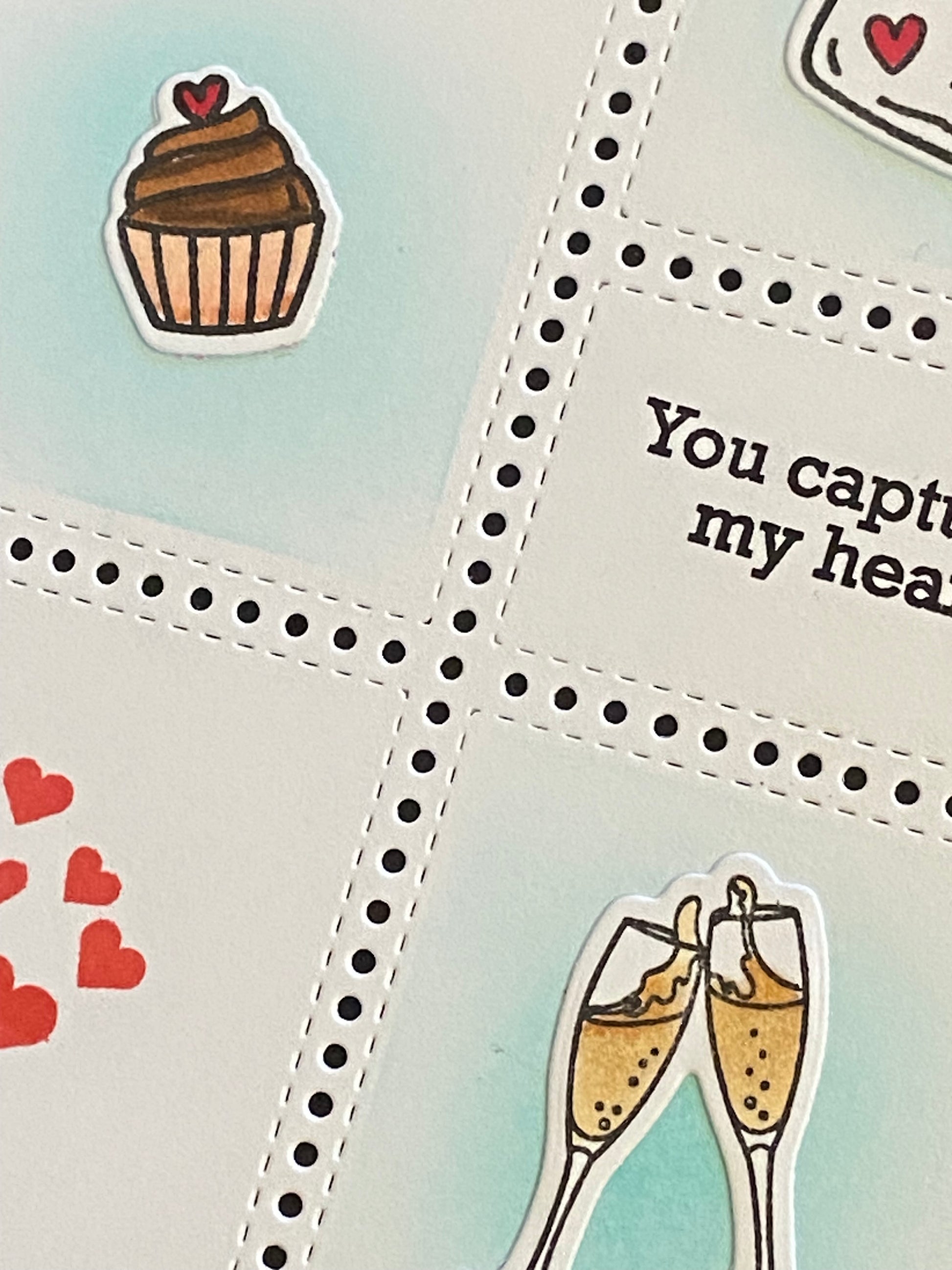 Close up view of the card detail to show stamped images and details