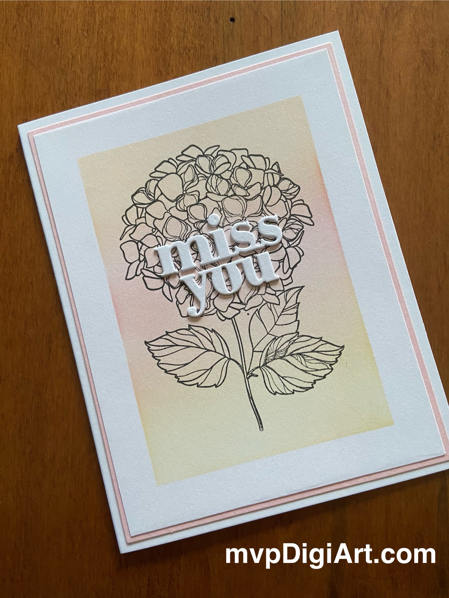 Handmade miss you card with cluster of pink and yellow hydrangeas and 'Miss You' sentiment on white background
