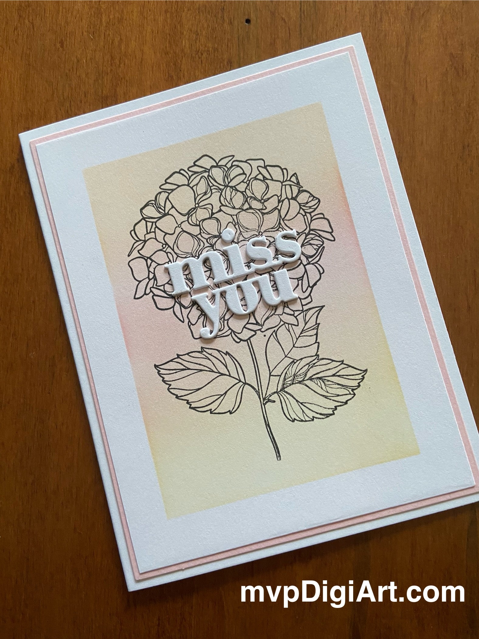 Handmade miss you card with cluster of pink and yellow hydrangeas and 'Miss You' sentiment on white background