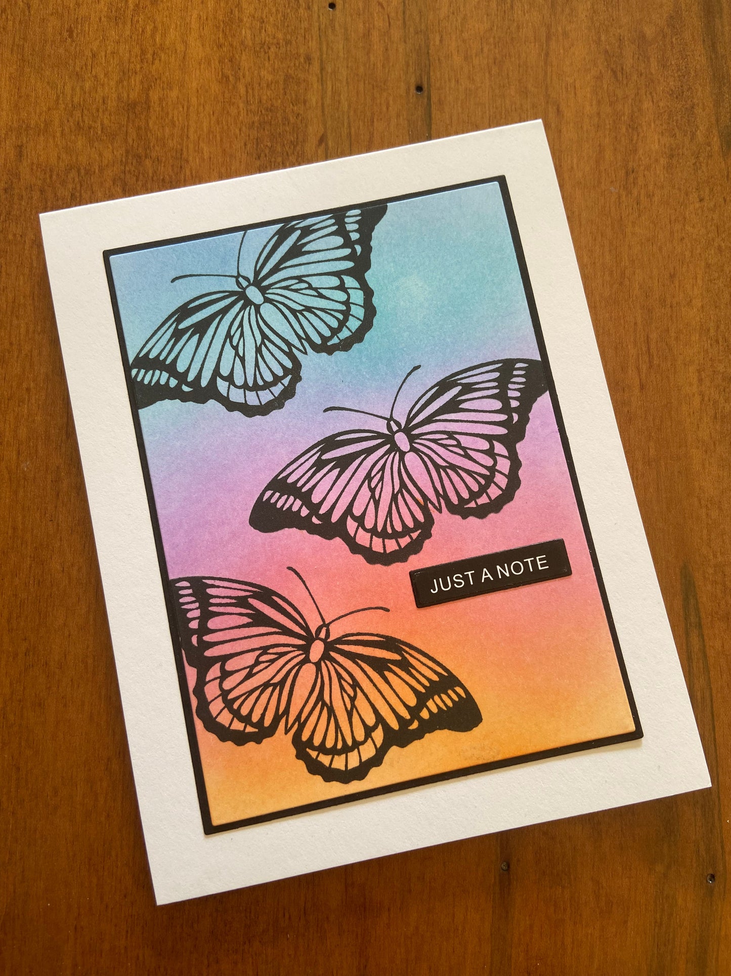 Greeting card with butterfly design and 'Just a Note' text, part of the 4 pack set