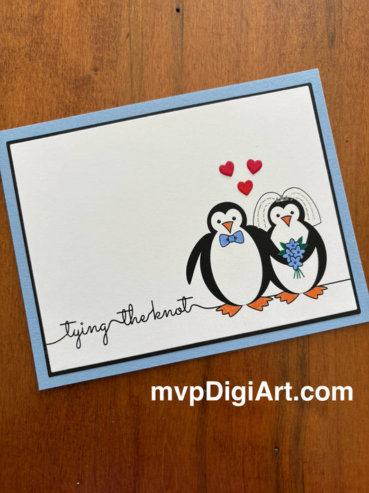 Card with penguins couple with red hearts, original artwork, and text 'tying the knot' on a light blue note card