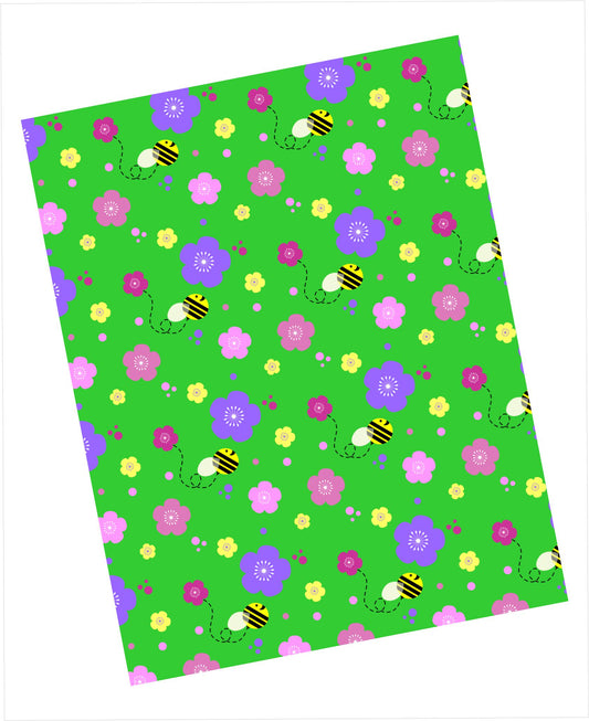 Cardstock with a clover green background, multicoloured floral pattern and buzzing bumblebees