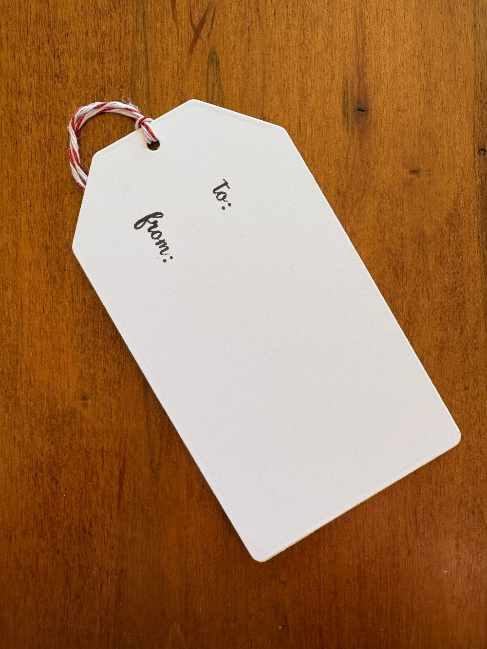 The backside of the gift tag showing 'to and from' text