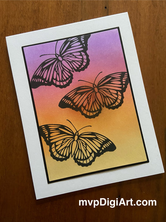 Handmade all occasion card with ink blended yellow, orange, and purple background featuring black butterfly silhouettes - front view