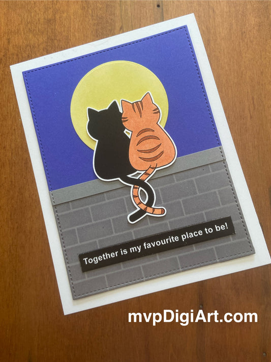 Card with two cats with tails entwined sitting on wall under the moon. White text on black 'together is my favourite place to be'