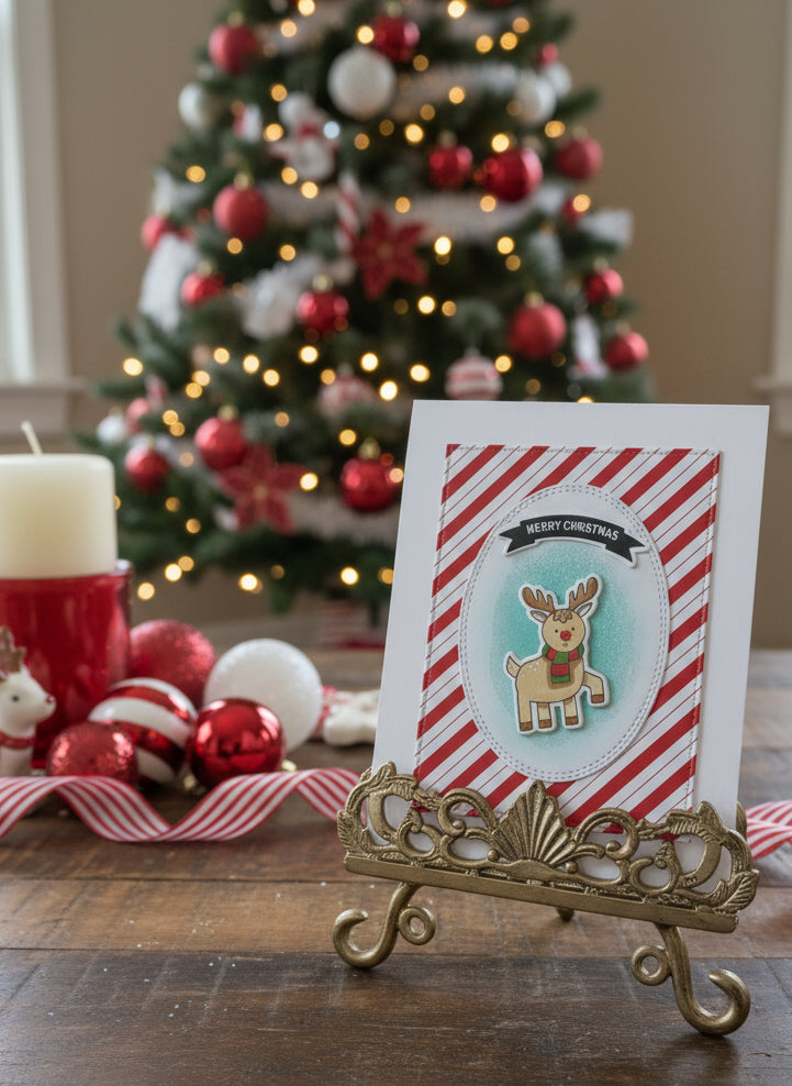 Christmas card with cute penguin on candy cane striped background displayed with festive holiday decorations