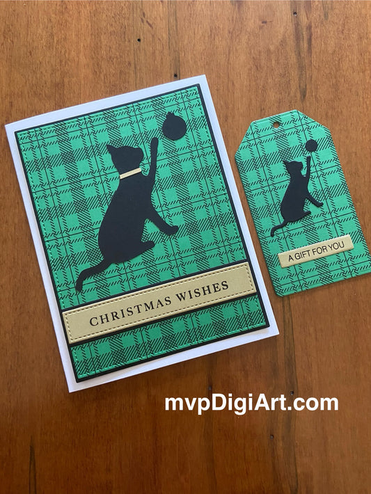 A Christmas card featuring a black cat silhouette playing with a Christmas ball on a green and black plaid background, accompanied by a matching gift tag.