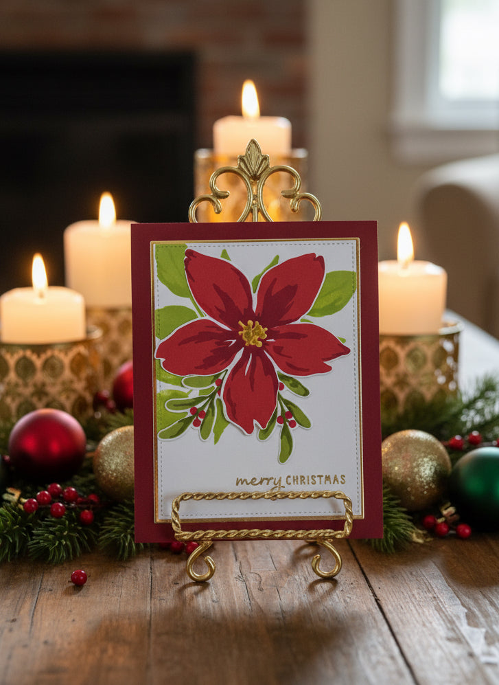 Christmas card with red background, poinsettia flower, and greenery with 'Merry Christmas' message displayed on a decorated table with holiday decorations