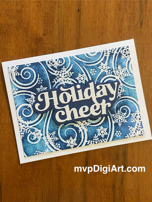 Handmade Christmas card with swirling blue and white snowflakes with glitter accents and die-cut Holiday Cheer sentiment
