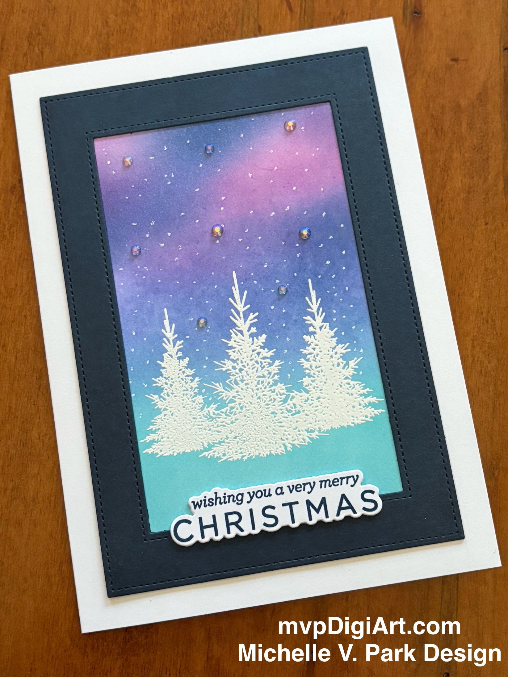 Christmas card with snowy trees and 'Wishing you a very merry Christmas' 