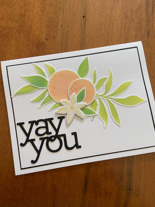 Card with 'yay you' text and orange and oraange blossom floral design