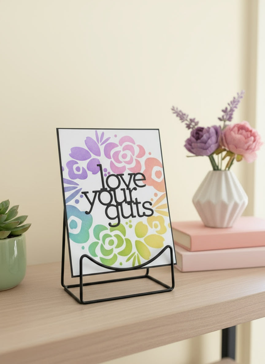Handmade love card with 'Love Your Guts' sentiment and modern floral wreath design displayed on decorated shelf