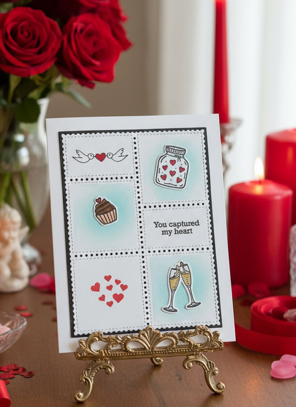 You captured my heart love card displayed on a table with red roses and candles.