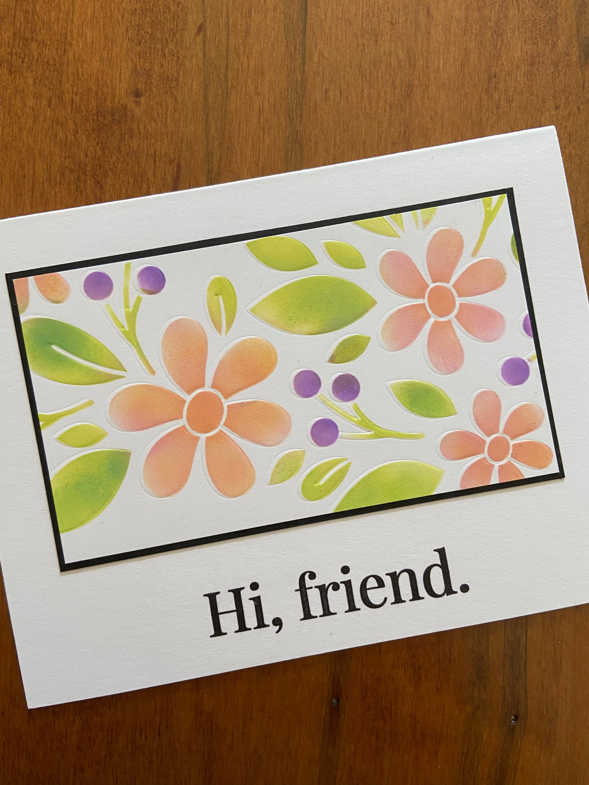 Floral hi friend handmade card. Stencilled pink daisy like flowers with greenery and purple berries. 