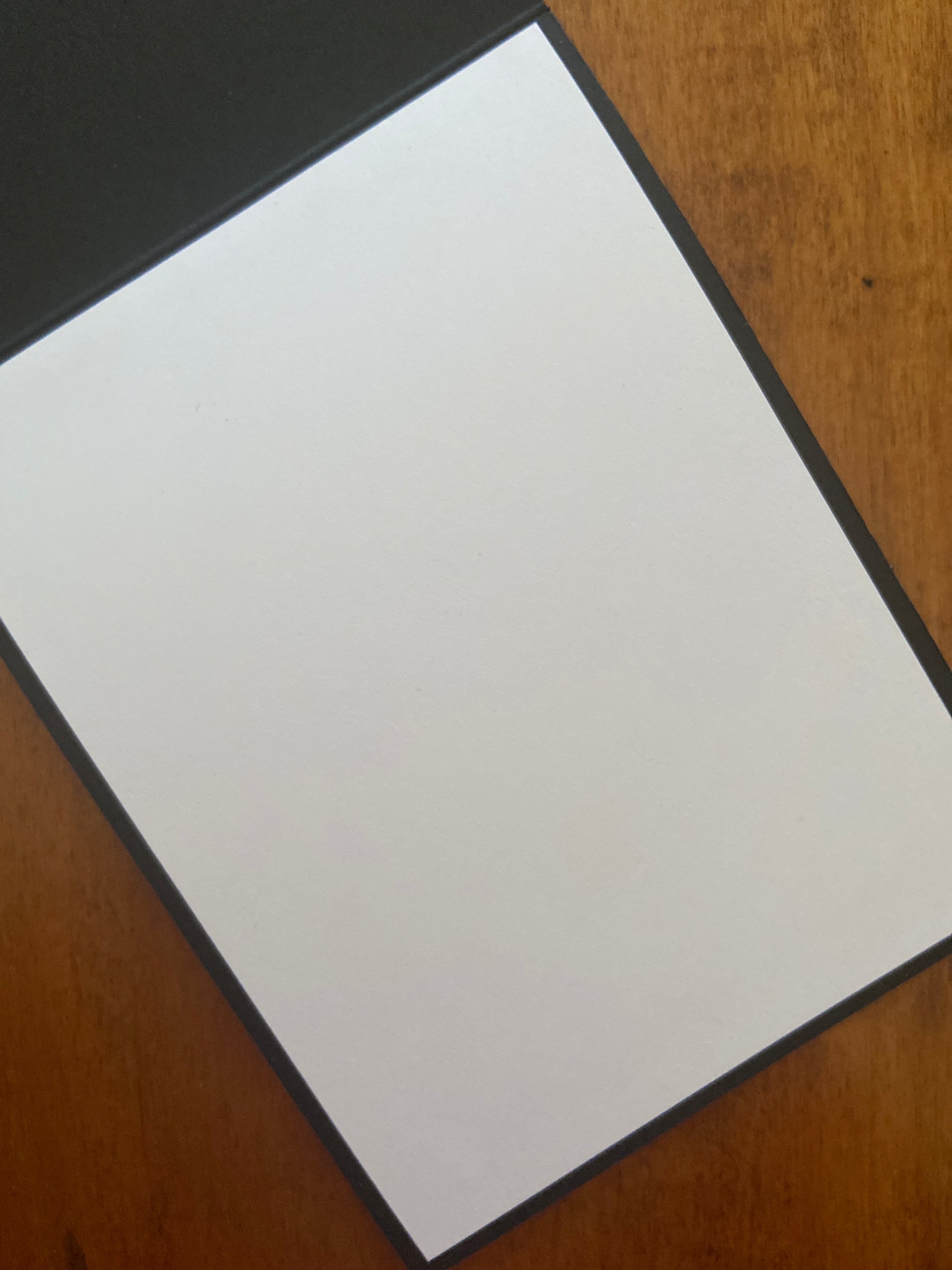 White panel on the inside of the card for your message since the notecard base is black card stock.